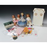 A collection of 1970s Pedigree Sindy dolls and accessories, including four dolls, a kitchen set, a