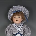 An Armand Marseille bisque head 'walker' doll, impressed '390 A4M', with later brown wig, sleeping
