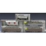 A collection of Fleischmann gauge HO coaches, finished in various liveries, and goods rolling stock,