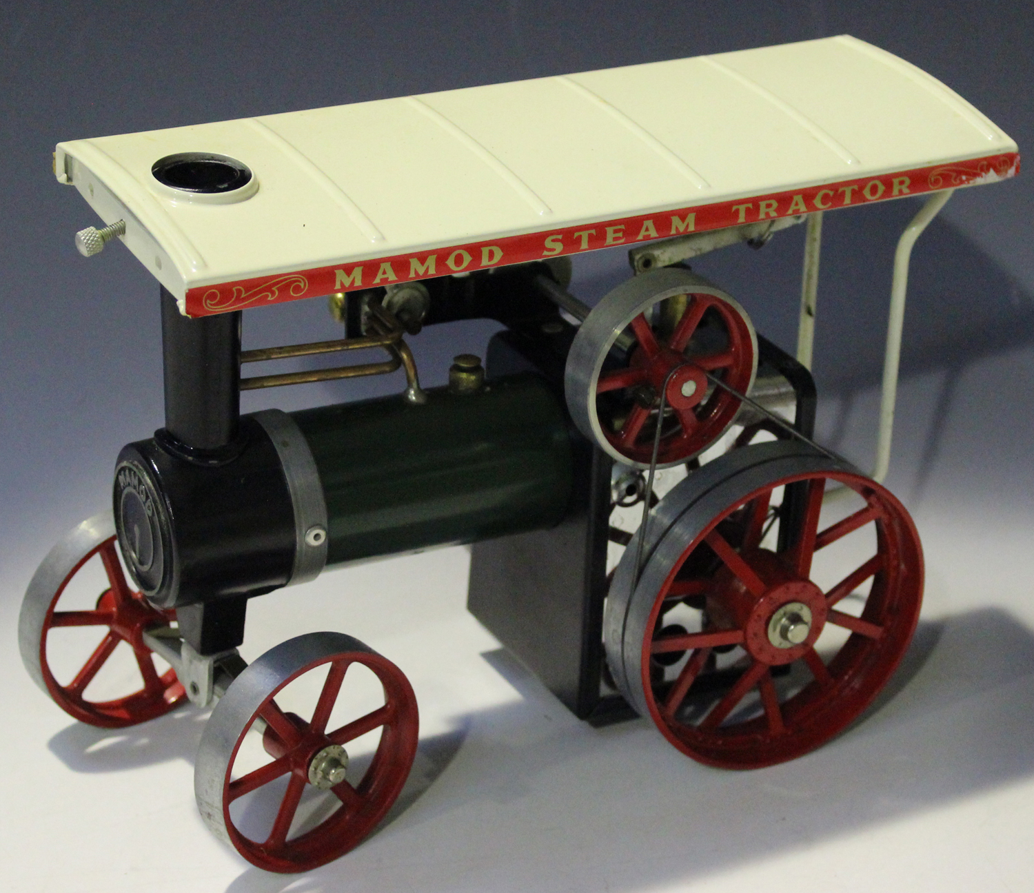 A Mamod steam tractor, boxed (some paint chips, box creased, torn and scuffed).Buyer’s Premium 29.4%