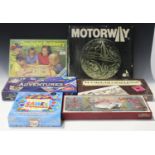 A collection of board games, including 'The London Game' by Condor, 'Genius', 'Daylight Robbery' and