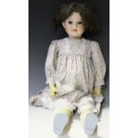 An Armand Marseille bisque head doll, impressed '390n DRGM 246/1 10', with later brown wig, sleeping