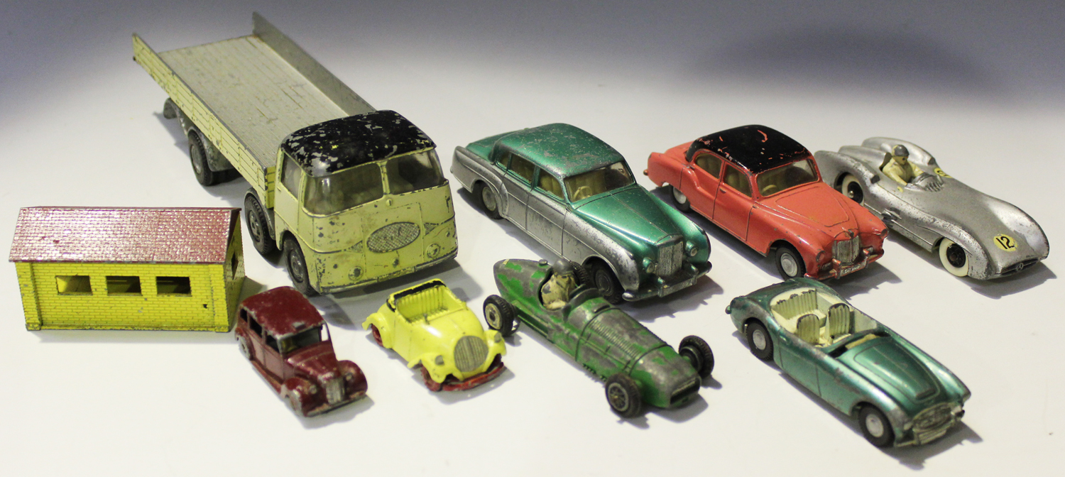 Four Tri-ang Spot-On vehicles, comprising a No. 109 ERF dropside lorry, a No. 102 Bentley saloon,