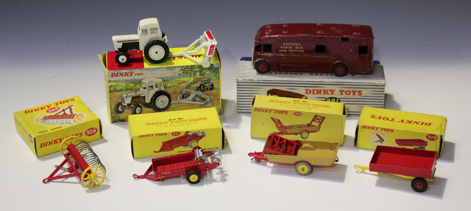 A small collection of Dinky Toys farm items, comprising a No. 325 David Brown tractor with disc