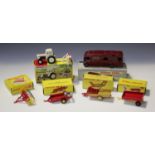 A small collection of Dinky Toys farm items, comprising a No. 325 David Brown tractor with disc