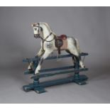 An early 20th century dapple grey rocking horse with black and white eyes, mane, tail and leather