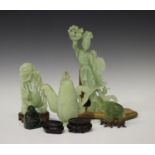 A small group of Chinese jade and green hardstone carvings, 20th century, including a celadon jade