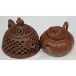 A Chinese Yixing stoneware teapot and cover with recumbent Buddhistic lion finial, the lobed