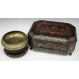 A Chinese export lacquer work box, early 19th century, of oblong form with canted corners, the