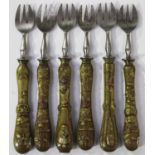 A near set of six Japanese mixed metal handled steel forks, Meiji period, each copper handle