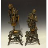 A pair of Chinese carved rootwood figures of Li Tieguai, late Qing dynasty, each sectional figure on