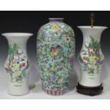 A pair of Chinese famille rose porcelain vases, 20th century, each painted with figures in