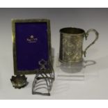 A Victorian silver christening mug, engraved with foliate panels within beaded rims, London 1871,