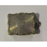 A Victorian silver vinaigrette of shaped rectangular outline with engraved decoration, the gilt