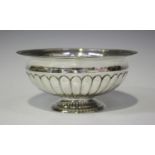 An early 19th century Swedish silver sugar bowl with beaded rim and reeded body, on a circular foot,