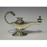 A George V silver novelty table lighter in the form of Aladdin's lamp, the scroll handle with bird