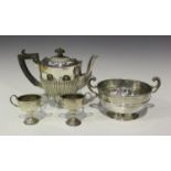 An Edwardian silver oval half-reeded bachelor's teapot, Birmingham 1908 by William Aitken, height