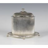 A Victorian silver biscuit barrel of reeded cylindrical form with similarly decorated hinged lid, on