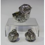 A pair of Victorian silver novelty salt and pepper casters, each in the form of a chick with a