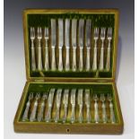 A set of twelve George V silver fruit knives and forks, Sheffield 1911 by Cooper Brothers & Sons