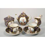 A late 18c Sevres part teaset of Gros Bleu ground with gilt pattern and fleur de lys in white relief