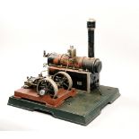 A Marklin model steam factory with 11in boiler, driving twin pulley wheels, each 4in diam.