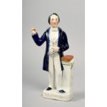 A 19c Staffordshire figure of C.H Spurgeon, the baptist preacher, 12.5in h.