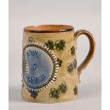 A Doulton Lambeth tankard, 'Bred at Pleasure, Drink by Measure', 4in h.