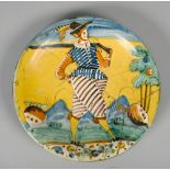 Two 17c Montelupo chargers painted with a rifleman and a drummer in typical costume and palette,