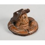 A late 19c Doulton Lambeth match holder titled 'Saved' modelled as a man clasping a lifebuoy, 4in w,