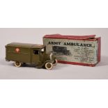 A boxed Britains army ambulance with driver and wounded man, in red box.