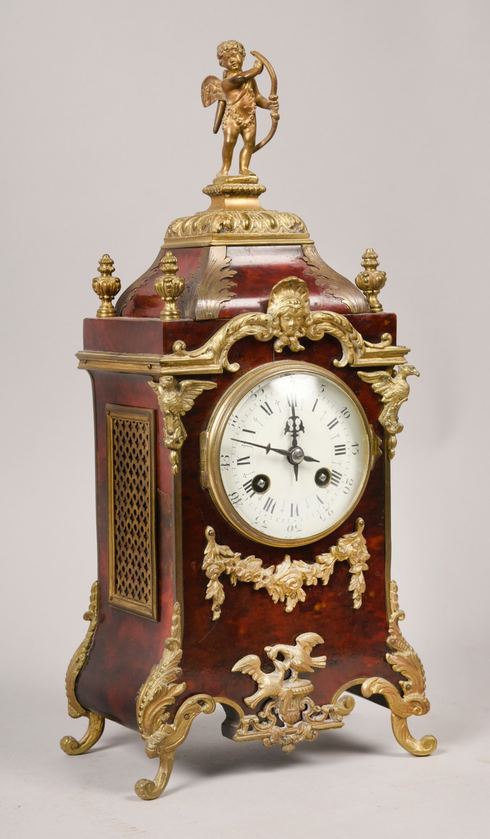 A late 19c French mantel clock in tortoiseshell case with cast gilt mounts and feet. The case