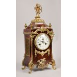 A late 19c French mantel clock in tortoiseshell case with cast gilt mounts and feet. The case