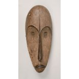 An African carved wood face mask, 18in h.