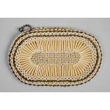 A bead and seed pearl decorated Belgin evening purse together with one other of white bead and quill