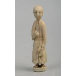 A carved ivory figure standing robed, 3.25in h.