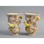 A pair of 19c Meissen Schneeballen vases of trumpet form applied with yellow birds and gilt trailing