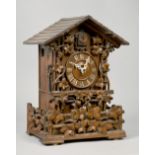 A late 19c Black Forest chalet style cuckoo mantel clock retailed by Camerer Kuss & Co. The wooden