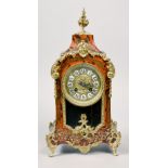 A late 19c French mantel clock in case with boullework front and having gilt mounts and feet. The