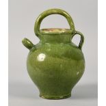 An 18c Continental green glazed water jug, chip to footrim and glaze chips, 11in h.