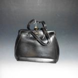 A Etienne Aigues black leather hand made handbag.