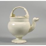 An 18c Pearlware water jug with serpent spout and handle terminals and having moulded scrollwork