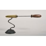 A Victorian iron and brass goffering iron with a plug, being of small proportion, 3.75in h.
