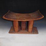 An Ashanti carved wood stool, 17.5in w, 13in h.