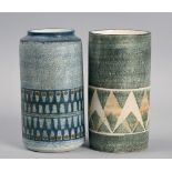 Two Troika cylindrical vases of abstract banding on green and blue grounds, factory and artist