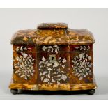 A late Georgian blond tortoiseshell two compartment tea caddy of serpentine form, the caddies with