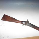 A 19c Tower Proof percussion musket with walnut stock, the barrel 39in l, with original ram rod.
