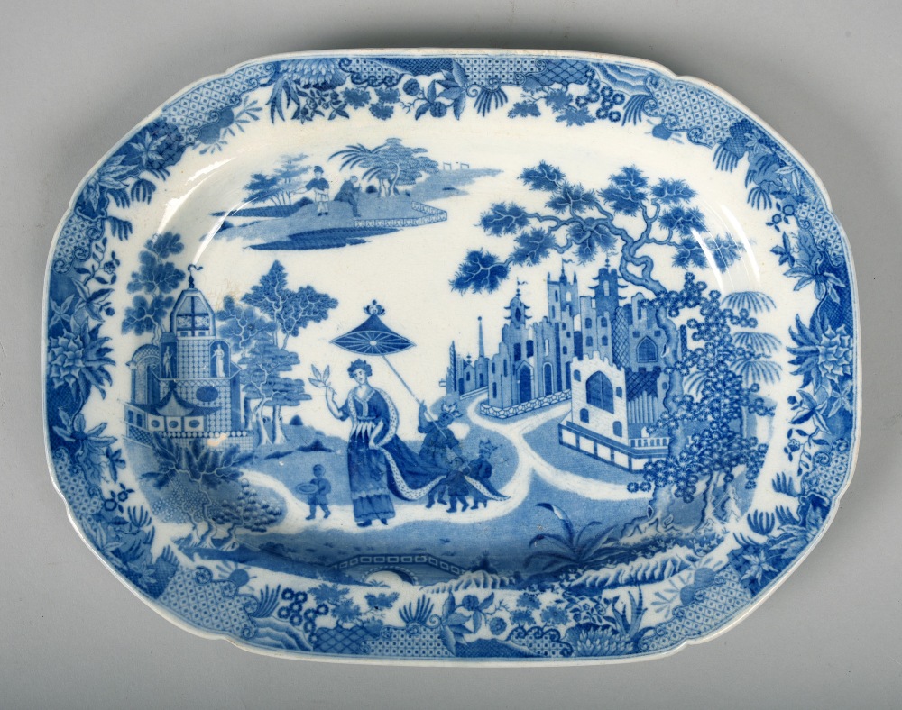 An early 19c Pearlware meat plate, decorated with a lady with attendants and parasol, 12.5in w.