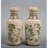 A pair of 19c Satsuma vases of baluster form with restrained bamboo panel decoration, clouds and
