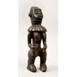 A 19c African carved wood standing female figure, 14in h.